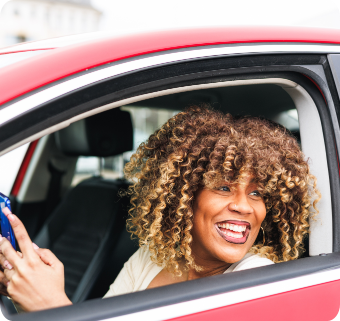 Jordan happy in her car after using Cacheo